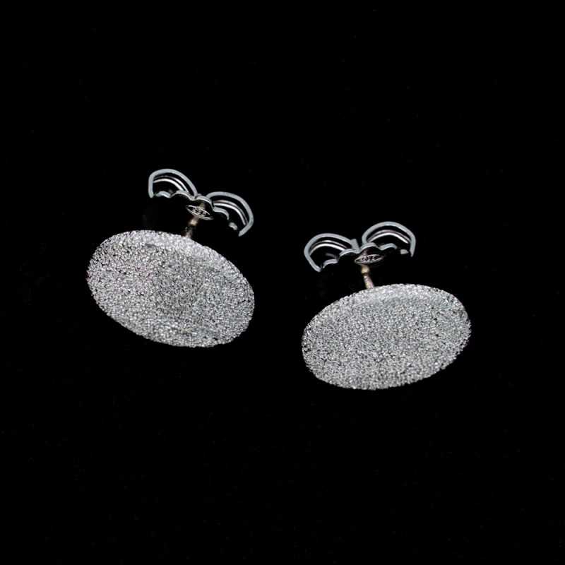 Silver earrings hand engraved with a...