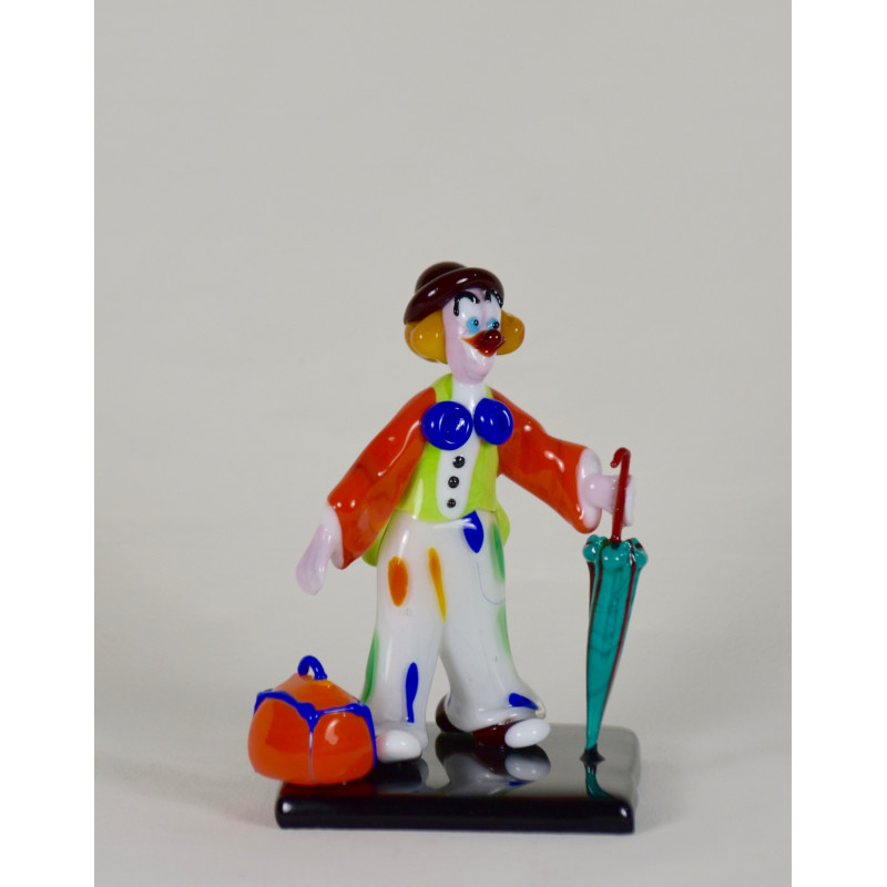 Clown with umbrella and suitcase